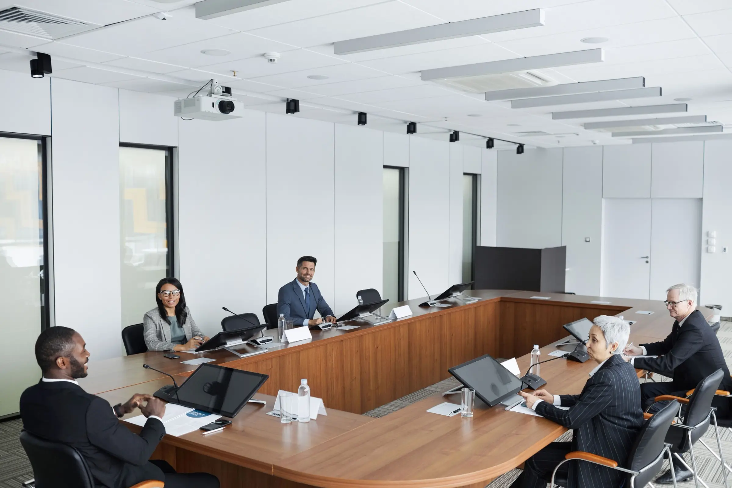 Enterprise leaders in a formal boardroom meeting